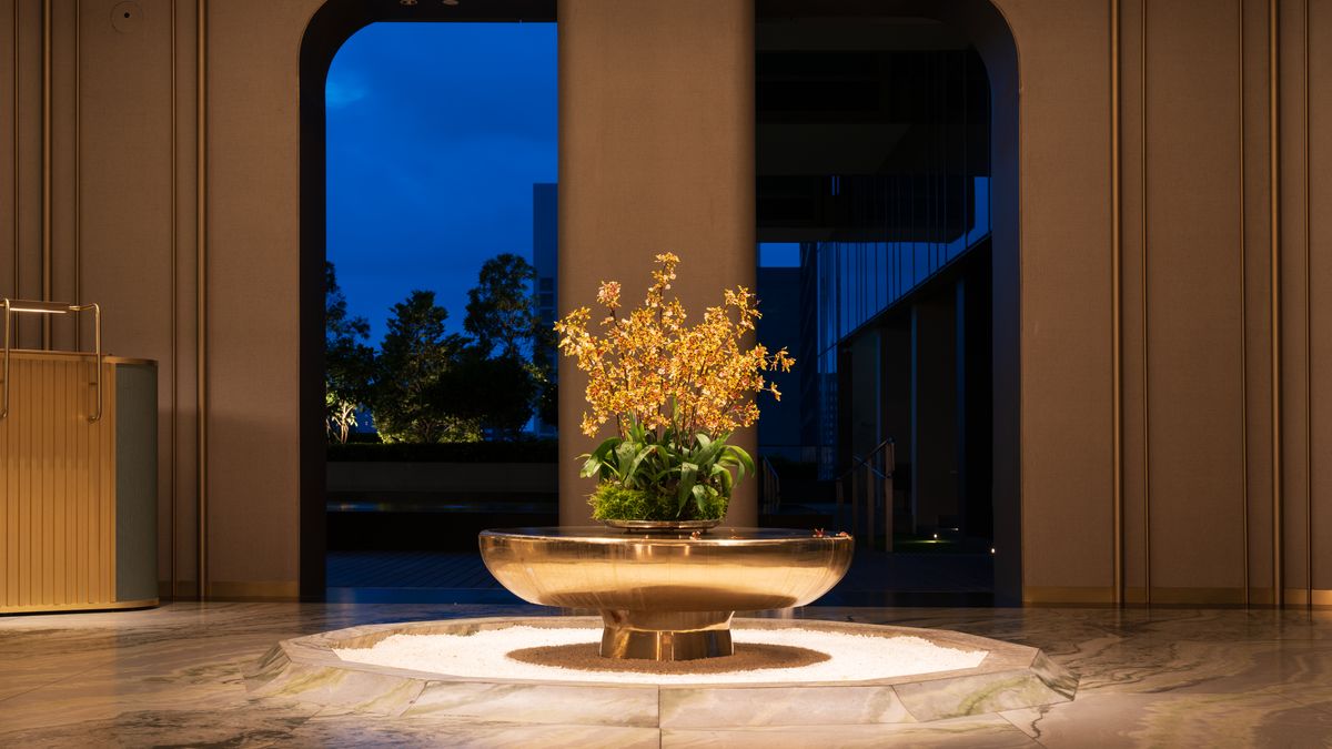 Mark Baldovino / Pexels Elegant indoor flower arrangement in a hotel lobby in Singapore at night.
