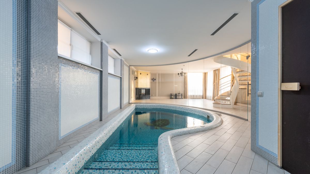 Max Vakhtbovych / Pexels Small swimming pool in spa zone with tiled floor and walls of spacious villa on sunny day
