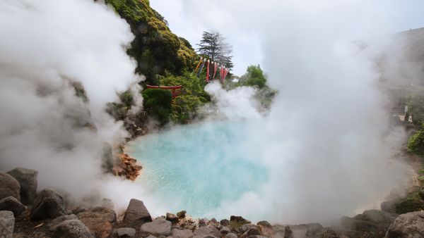 Geothermal hot spring with steam and rocky surroundings in Beppu, Japan, famous for its hot spring hells.