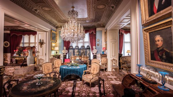 A beautifully decorated historic drawing room featuring opulent furnishing and architectural details.
